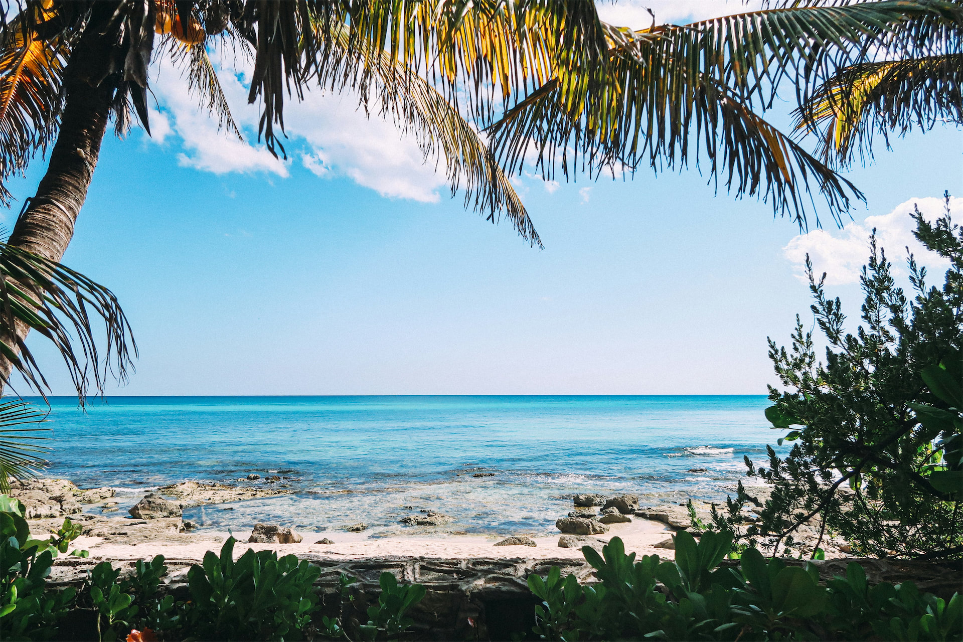 Tropical beach image supporting the salon's relaxing feel