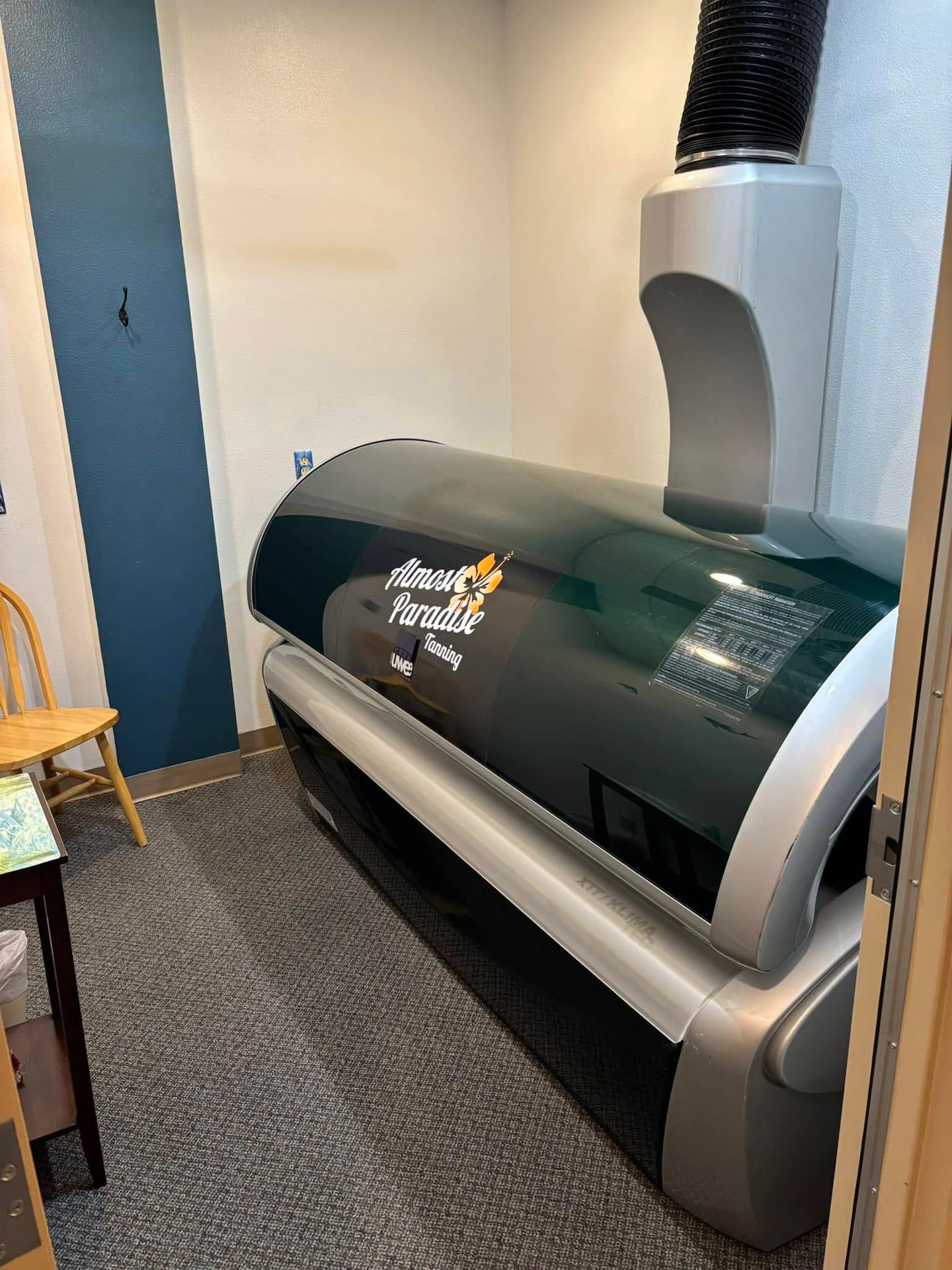 V-3 stand-up tanning bed at Almost Paradise Tanning